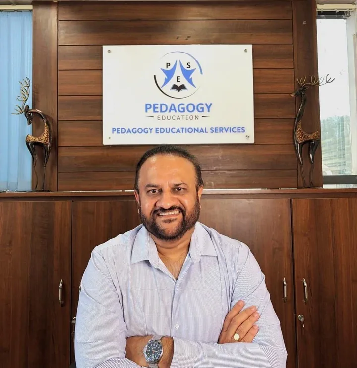 Ashok Mohanraju, founder of Pedagogy Educational Services, seated in the PES office